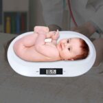 SRSB128 digital baby scale with a baby on the tray