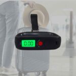 SRS530 luggage scale weighing a suitcase, green backlit display
