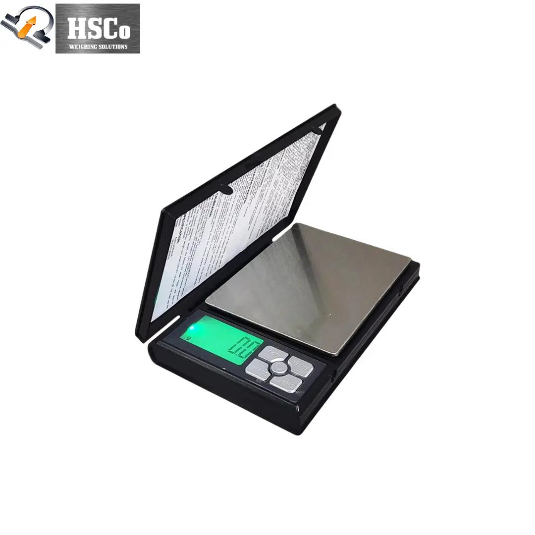 SRS320 Notebook Precision Scale – 500 g × 0.01 g, Pocket Size 1 SRS320 notebook precision scale open, showing stainless pan and green backlit display