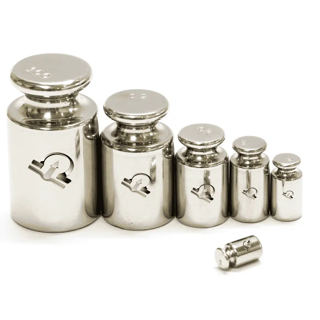 Row of stainless steel calibration weights from large to small, HSCo emblem