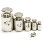 Row of stainless steel calibration weights from large to small, HSCo emblem