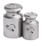 Two stainless steel calibration weights etched with the HSCo emblem