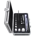Weight box open, standing, with weights and tweezers