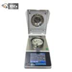 Moisture analyzer with lid open and sample on the pan
