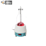 Heating mantle heating a round-bottom flask with red liquid