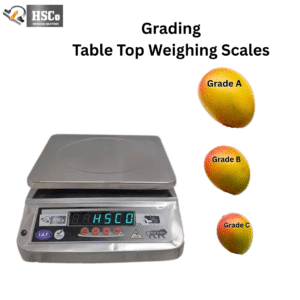 HSCo tabletop mango grading scale with digital display beside Grade A, B and C mango examples
