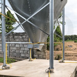 Outdoor silo standing on legs fitted with HSCo tank weighing load-cell mounts