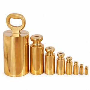 HSCo brass bottle weights in graduated sizes, with polished cylindrical bodies and a loop handle on the largest weight