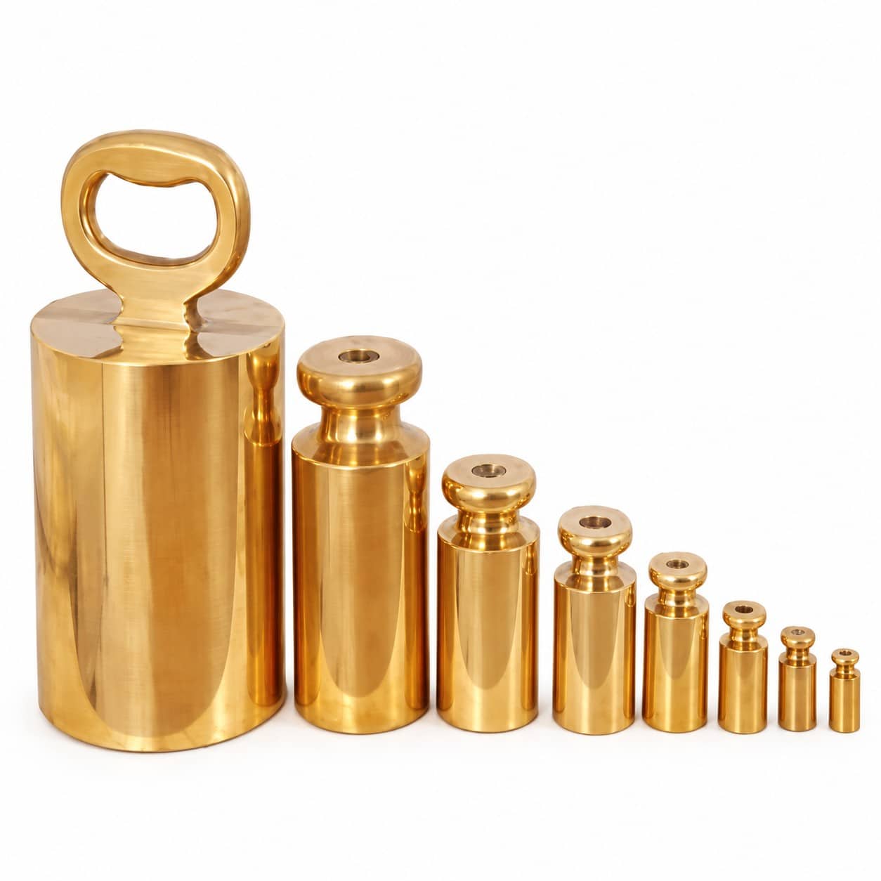 Brass-weight-1.jpg HSCo brass bottle weights in graduated sizes, with polished cylindrical bodies and a loop handle on the largest weight